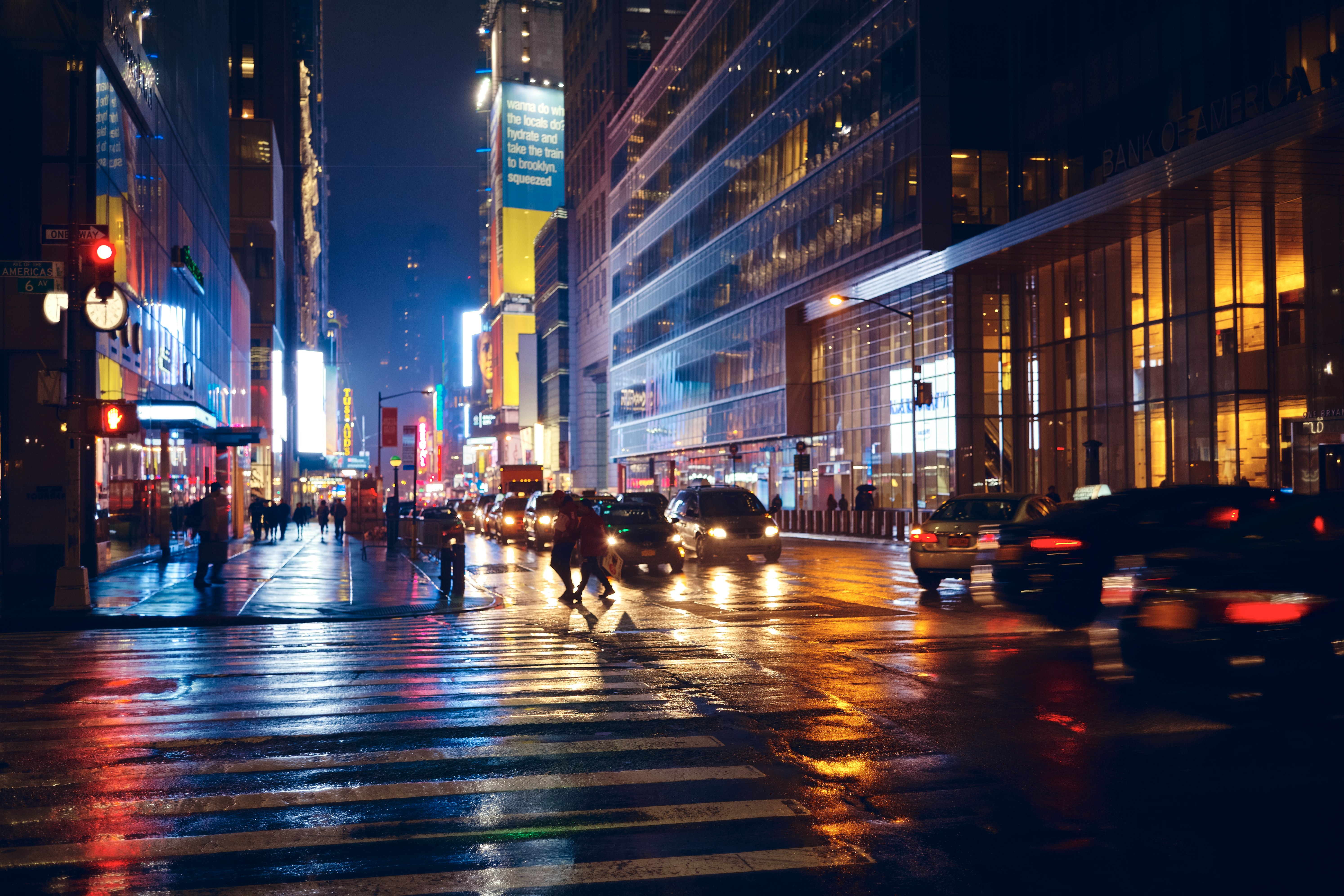 time-lapse photography of people and vehicles on road